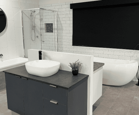 Bathroom materials and fittings staged for side-by-side comparison.